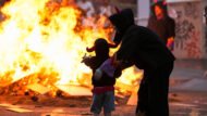 Diables a prop d'una foguera de Sant Joan.