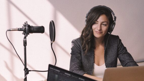 Female radio host broadcasting live in a studio